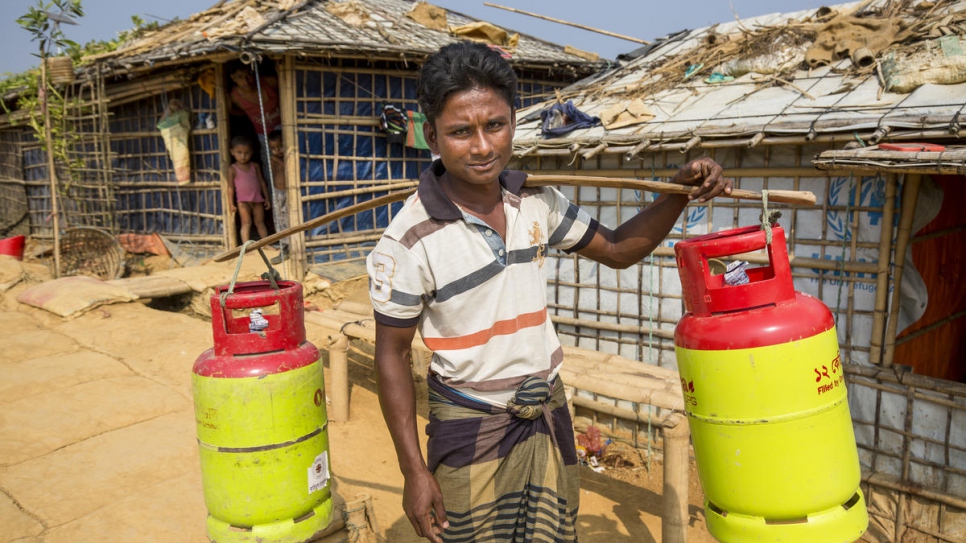 Azizur Rahman collects LPG refills at a UNHCR distribution centre in Kutupalong Refugee Settlement. "My children were constantly ill."

