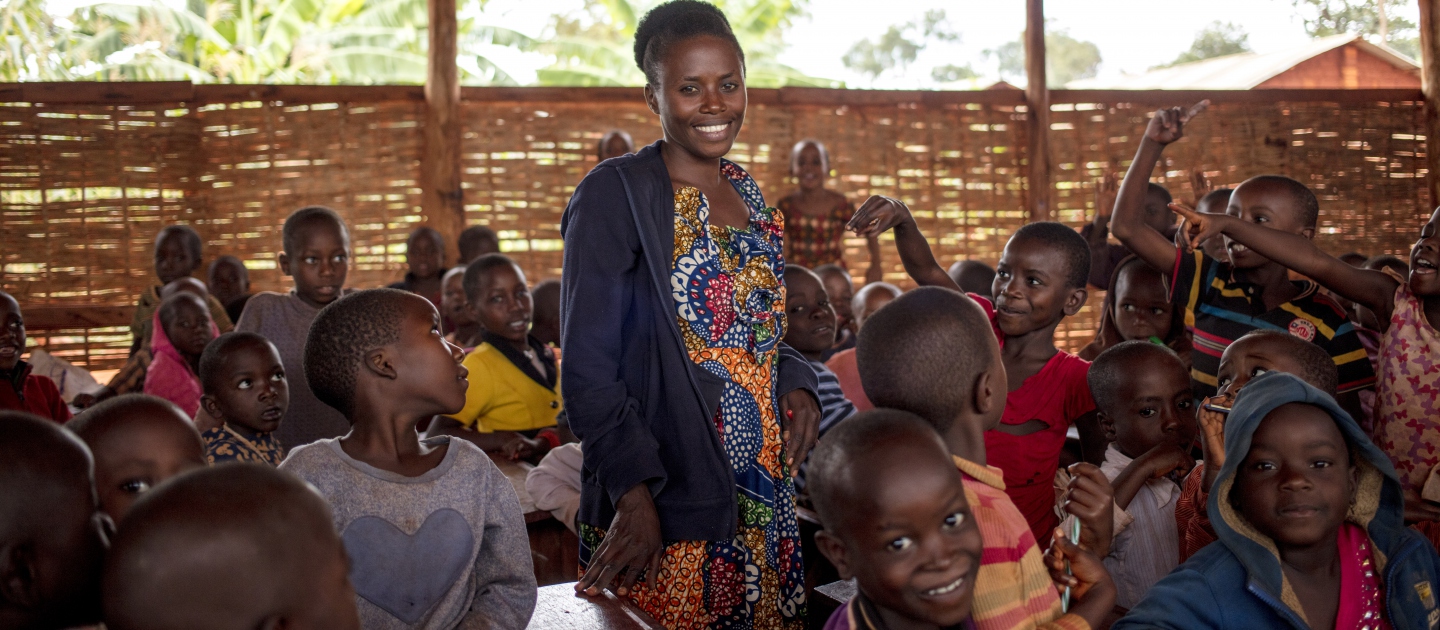 Burundian refugee teacher Nimbona Valyne, 26, teaches Kirundi to pupils at Jugudi Primary School in Nyarugusu Refugee Camp, Kigoma Province, western Tanzania. There are 68 boys and 44 girls in Nimbona's class.