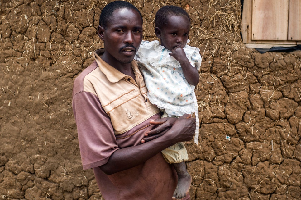 Innocent and Flavia outside their home in Uganda's Nakivale refugee settlement.