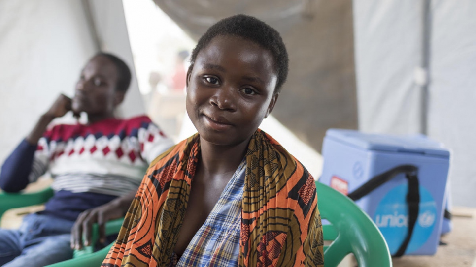 Agnes Manda, 18, a member of the Zambian host community, waits for a check-up at a clinic managed by UNHCR, UNICEF and Médecins Sans Frontières at the Mantapala Settlement.