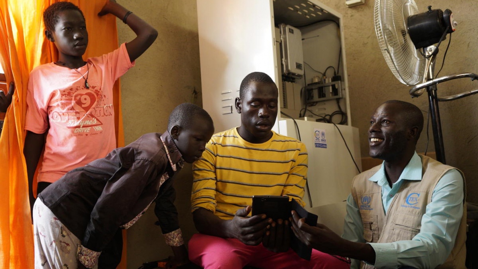 South Sudanese refugee Peter Batali runs a community initiative that helps young Ugandans access online learning platforms. Uganda allows refugees to work, start businesses and own property. 
