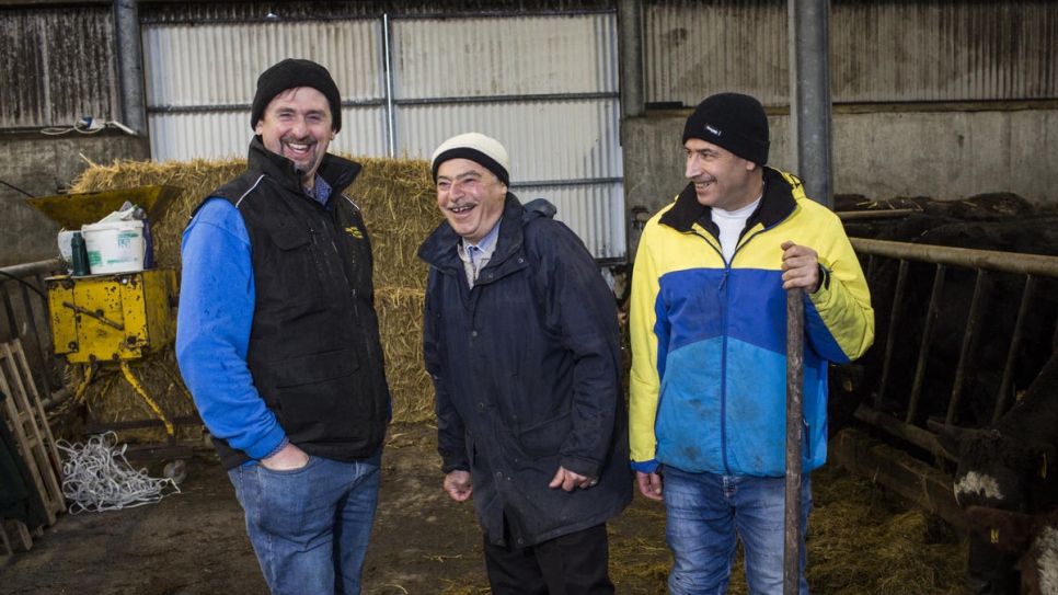 Irish farmer Oliver works with Abdulhadi, 72, and Faisal, 45, on his farm County Mayo.