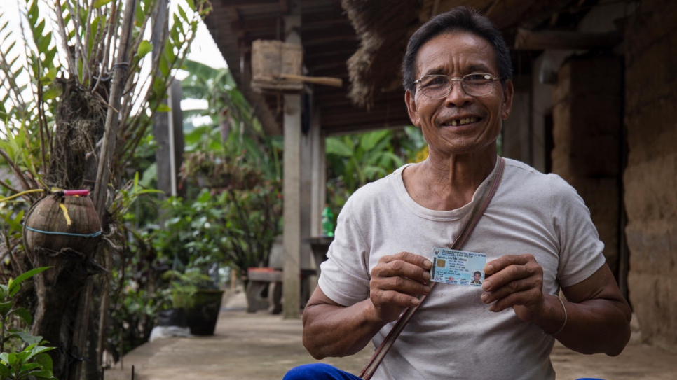 A formerly stateless man from the Lisu hill tribe shows his ID card in northern Thailand. He was supported by 2018 Nansen Award finalist for Asia, Tuenjai Deetes, in applying for citizenship.
