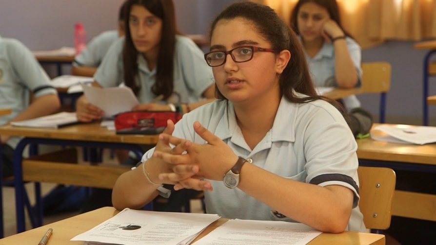 Given a helping hand, Syrian schoolgirls excel in exile