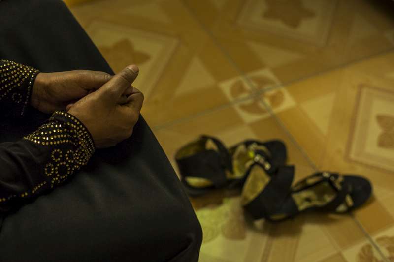 Unaccompanied Yemeni refugee minor Khayria Abdel Wahab sits with her hands clasped at a women-only safe house in Somaliland/Somalia.