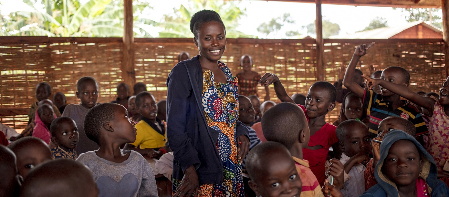 Burundian refugee teacher Nimbona Valyne, 26, teaches Kirundi to pupils at Jugudi Primary School in Nyarugusu Refugee Camp, Kigoma Province, western Tanzania. There are 68 boys and 44 girls in Nimbona's class.