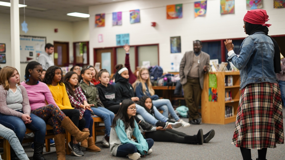 Children's book author and former Somali refugee Habso Mohamud answers questions from middle school students in Washington,D.C.