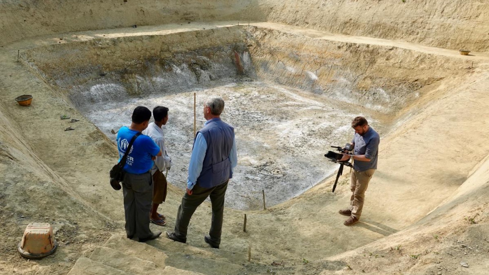 UN High Commissioner for Refugees Filippo Grandi visits a reservoir project for the local community in Maungdaw, Myanmar, which allows residents to capture rain water.