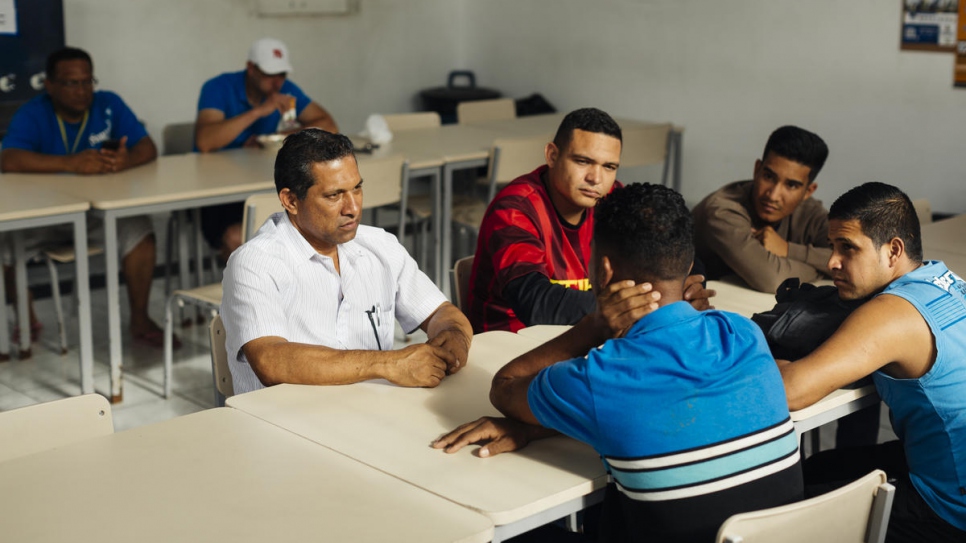 Gonzalez speaks to current residents of the Centro Transitorio de Acolhimento (CTA) in São Paulo, where he used to live.