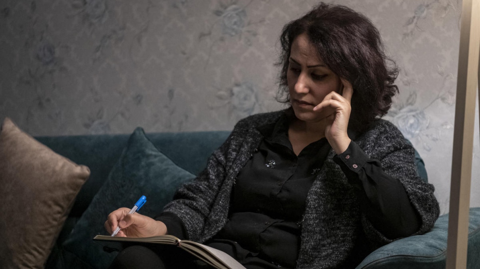 Nagham Nawzat Hasan, who was displaced from her hometown in 2014, sits at home in the city of Duhok in the Kurdistan region of northern Iraq.