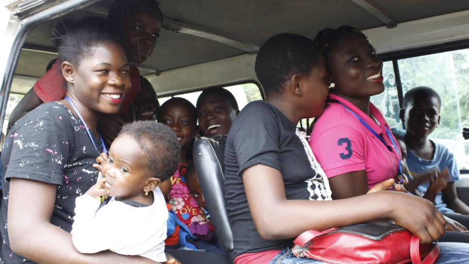 Myriam (left) travels to Adagom refugee settlement in Nigeria's Cross River State. 