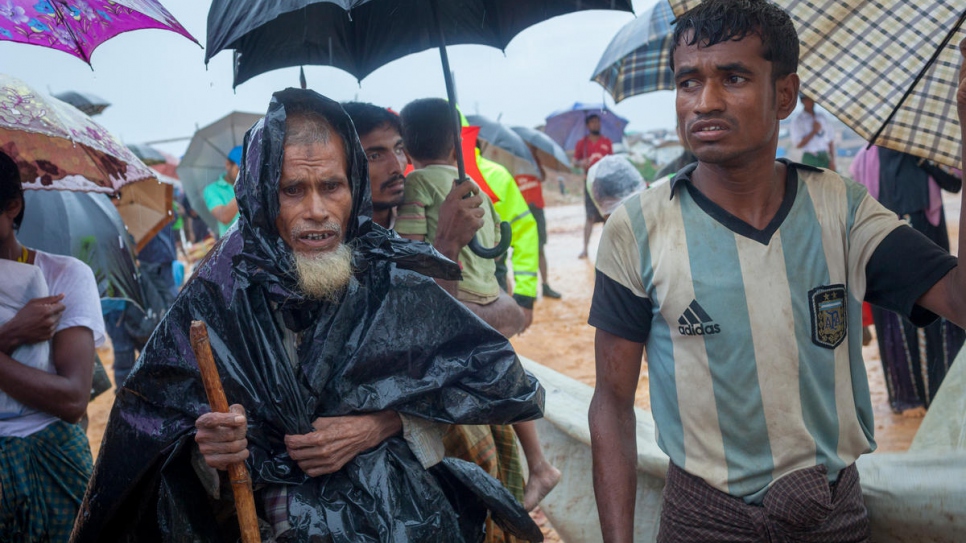 Heavy rains in Bangladesh have forced thousands of Rohingya refugees, including 60-year-old Sayedul Hoque and his family, to move into new shelters to avoid flooding.