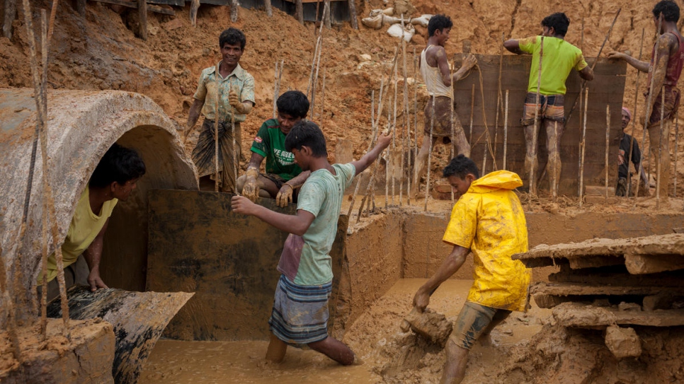 Refugees help to upgrade and repair the infrastructure around Kutupalong.