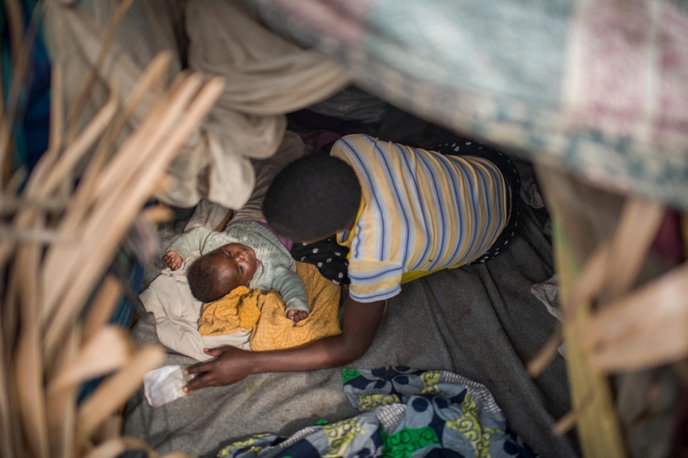 Democratic Republic of the Congo. IDP Woman in her shelter around Kalemie town