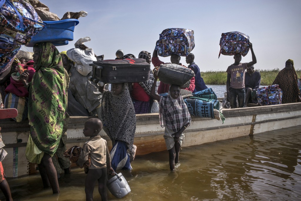 Nigerian refugees arriving on the shore of Baga Sola, in the lake Chad area, earlier this year. They escaped insurgents’ raids in their country and had been hiding in the Lake Chad islands until Chadian authorities rescued them and took them by pirogues to Baga Sola town. The refugees were later transported to Dar-es-Salam UNHCR camp, just some 12 kilometers away.