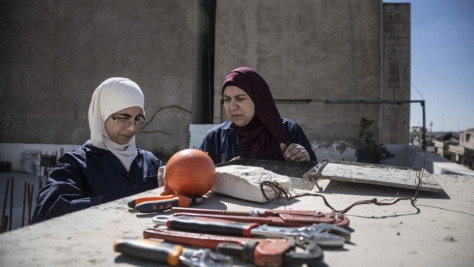 Jordan. Female plumber teaches refugees her trade