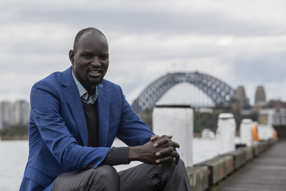 Dor Akech Achiek, from South Sudan, is pictured as Australians walk together with their neighbours from refugee backgrounds around Sydney harbour to celebrate World Refugee Day.