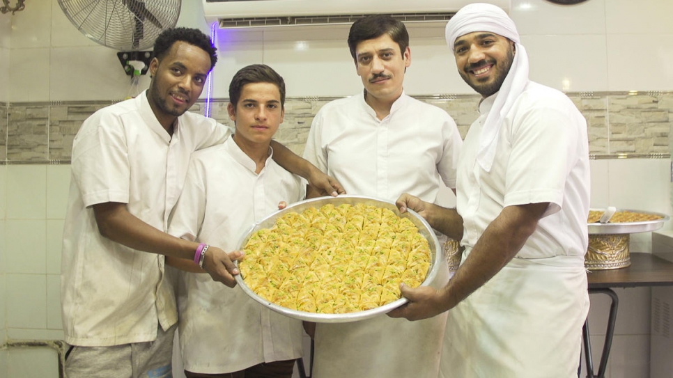 The shop's employees display their finished products.