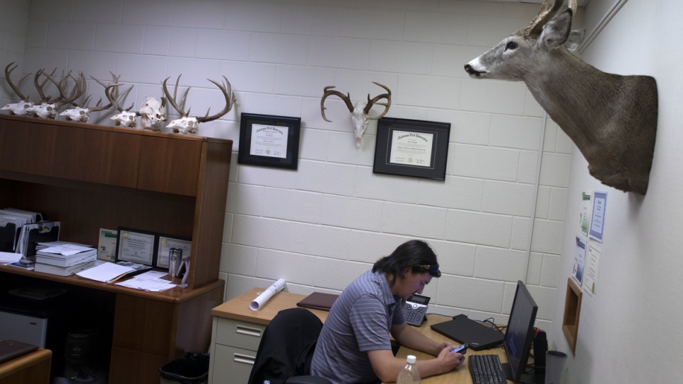 Cobi Cogbill, 31, works in his office  as an engineer for Simmons Foods' poultry plant in Decatur, Arkansas. 