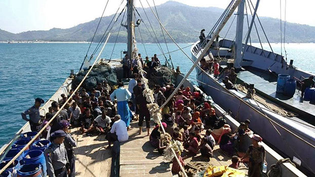 Myanmar authorities seize a boat carrying Rohingya Muslims from Rakhine state en route to Malaysia, off the coast of Dawei district in southern Myanmar's Tanintharyi region, Nov. 25, 2018.