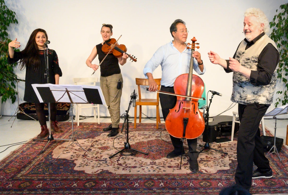 Vienna-based singer and Syrian refugee Basma Jabr, viola player Jelena Popržan, cellist Yo-Yo-Ma and artist Marwan Abado (from left to right) performing at an open music workshop in Vienna where people from across traditions, backgrounds and generations came together to play music and to make a statement for integration and social inclusion.