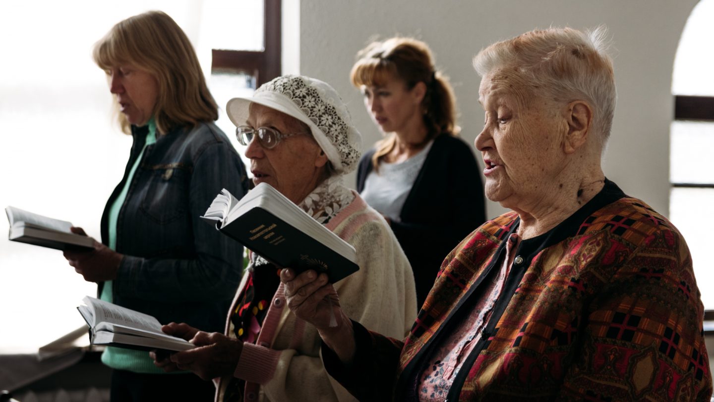 The parishioners of the New Apostolic Church sing prayer songs.