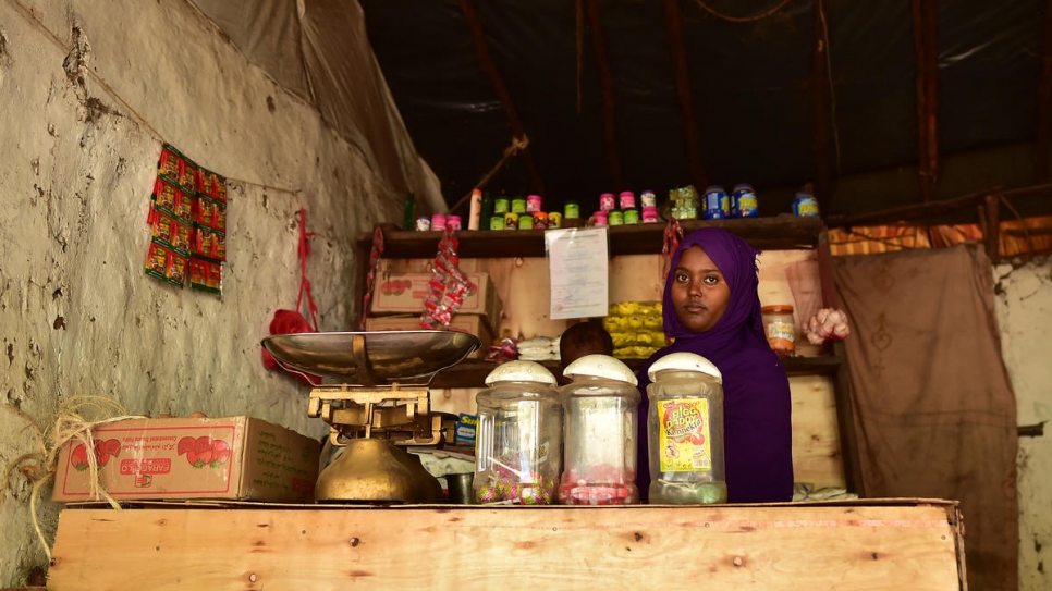 Fauzia, 23, from Ethiopia runs a grocery store in Kakuma Refugee Camp, Kenya.