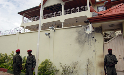 Guinean soldiers guard President Alpha Condé after a July 19 rocket attack. (AFP)