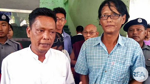 Myanmar activists Aung Hmine San (L) and Soe Moe Naing (R) leave court in Mandalay's Chan Aye Thar Zan township, May 22, 2018.