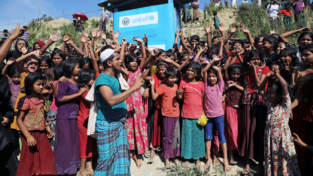 Hundreds of Rohingya refugees from Myanmar, including children, shout slogans as they protest against their repatriation at the Unchiprang camp in the Teknaf area of Cox's Bazar district, southeastern Bangladesh, Nov. 15, 2018.