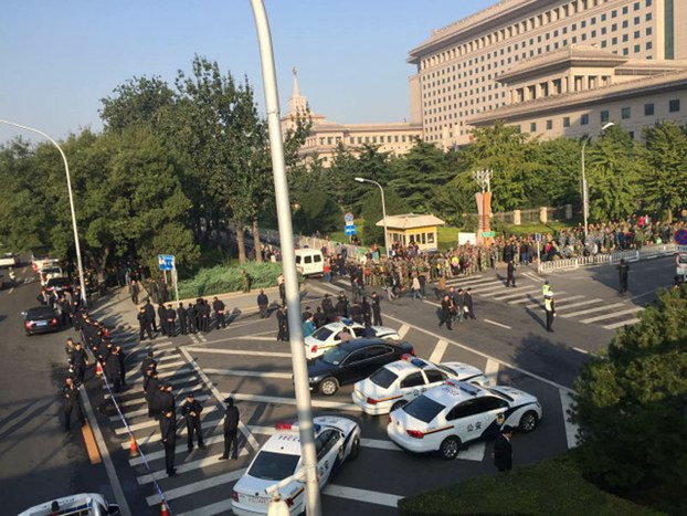 Thousands of former Chinese soldiers protest near the Communist Party Central Military Commission in Beijing, Oct. 11, 2016.