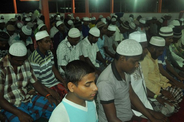Myanmar Rohingya people praying during Ramadan at a temporary shelter in East Aceh, Indonesia, some of thousands who arrived in countries across Southeast Asia in May, June 28, 2015.