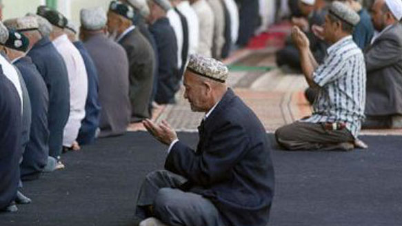 Muslim Uyghurs at prayer in the western Xinjiang city of Kashgar, in file photo.