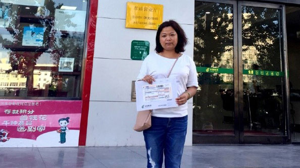 Feminist activist Wu Rongrong holds a letter appealing to the Minister of Education to allow her to pursue graduate studies in Hong Kong, Aug. 23, 2017.