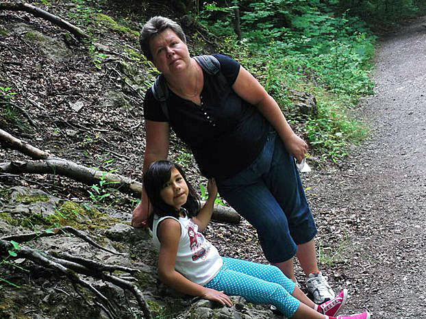 Barbara Paklak-Thammavong with one of her daughters in Poland in an undated photo.