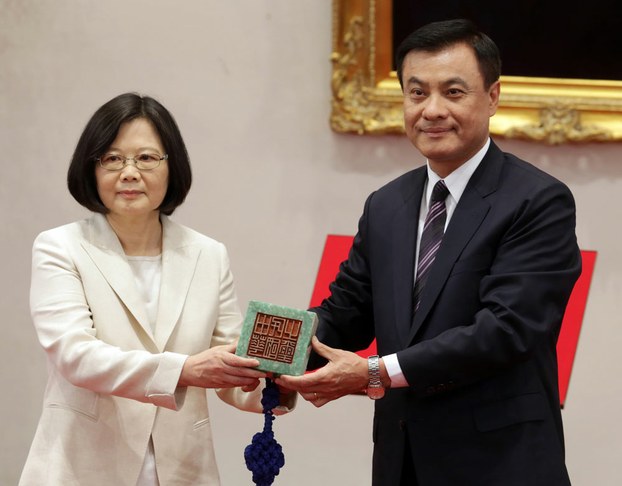 Taiwan's new President Tsai Ing-wen (L) receives a national stamp from Parliament Speaker Su Chia-chuan during Tsai's inauguration ceremony at the Presidential Palace in Taipei, May 20, 2016.