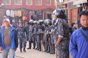 Nepal police step up security around the self-immolation site near the famous Boudhanath Stupa in Kathmandu, Feb. 13, 2013.