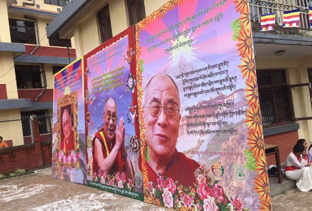 Portraits of the Dalai Lama are shown after their removal from a stage, Kathmandu, Nepal, July 6, 2016.