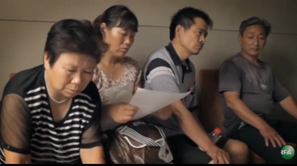 Henan parents of missing children discuss their sons' cases.