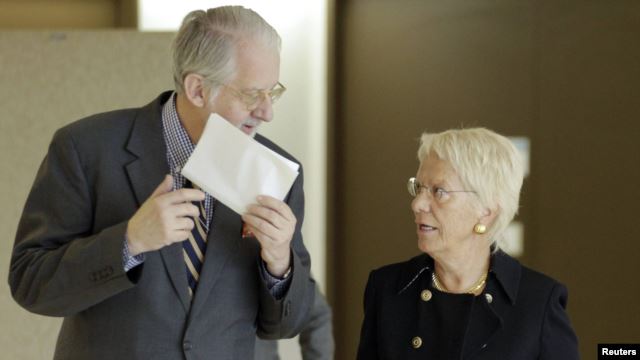 Chairman of the Commission of Inquiry on Syria Paulo Pinheiro arrives with commission member Carla del Ponte for a news conference in Geneva on October 25.