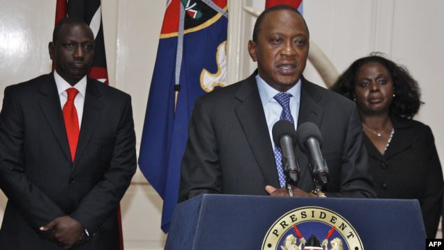 Kenyan President Uhuru Kenyatta speaks during a press conference in Nairobi in front of Kenyan Vice President William Ruto (left) on September 24.