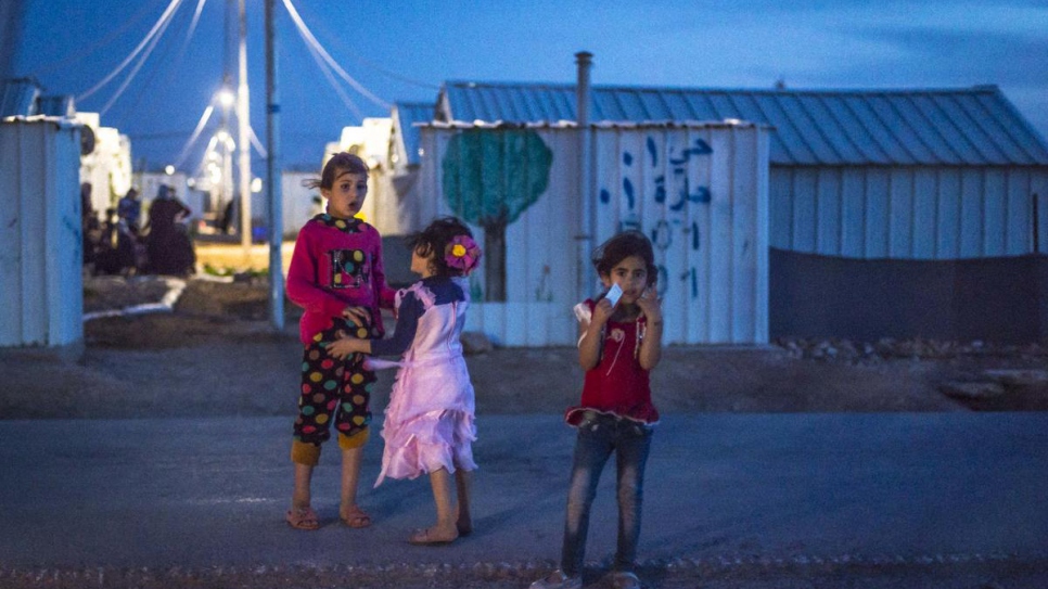 After opening of Azraq Refugee Camp's solar power plant, Syrian refugees can enjoy the evening outside their shelters.