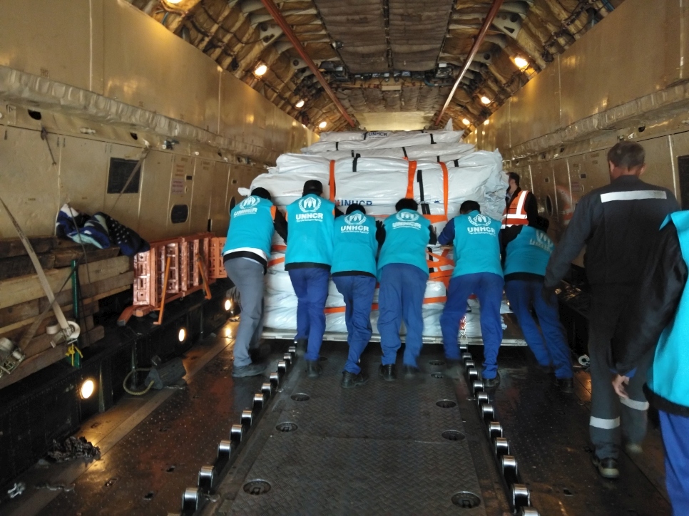 At Lahore airport in Pakistan, UNHCR staff load tents onto a plane bound for western Afghanistan, where drought and ongoing conflict have seen over quarter of a million displaced in the region.