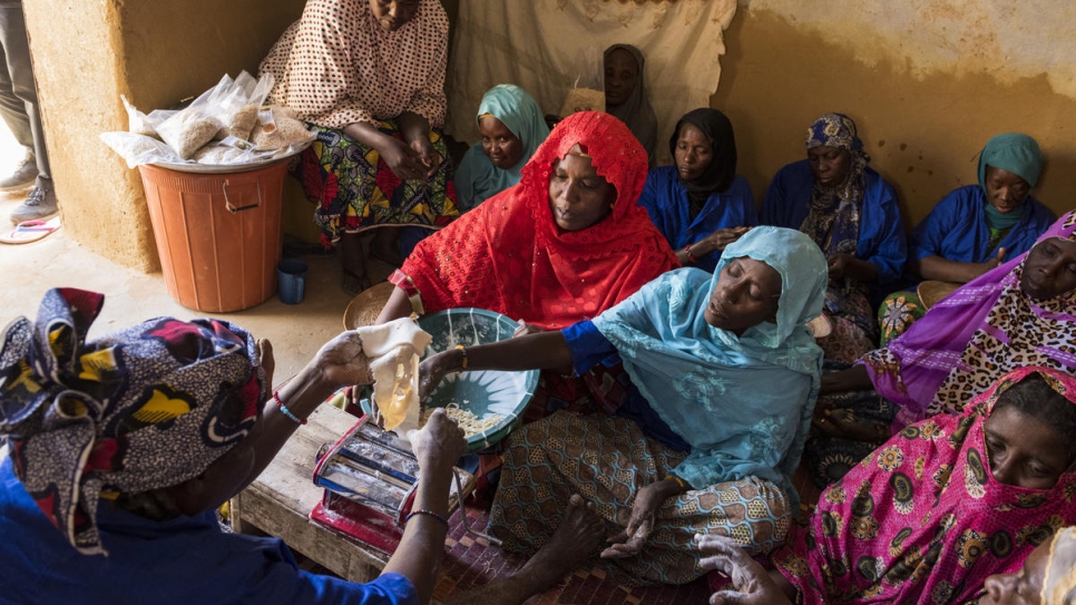 "We got together and decided we didn't want to keep asking for handouts," says Mariam Souleye Maiga (in red).