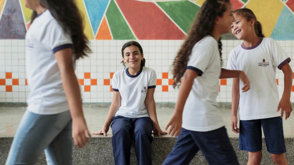 Syrian refugee Hanan Dacka (center), 12 years-old, plays with newly-made Brazilian friends Maria Luiza de Sousa, 12, Julia Vanderlei, 12, and Andressa Rabasco, 12, at the Duque de Caxias Municipal School, in the Glicerio neighborhood of downtown Sao Paulo, Brazil.
