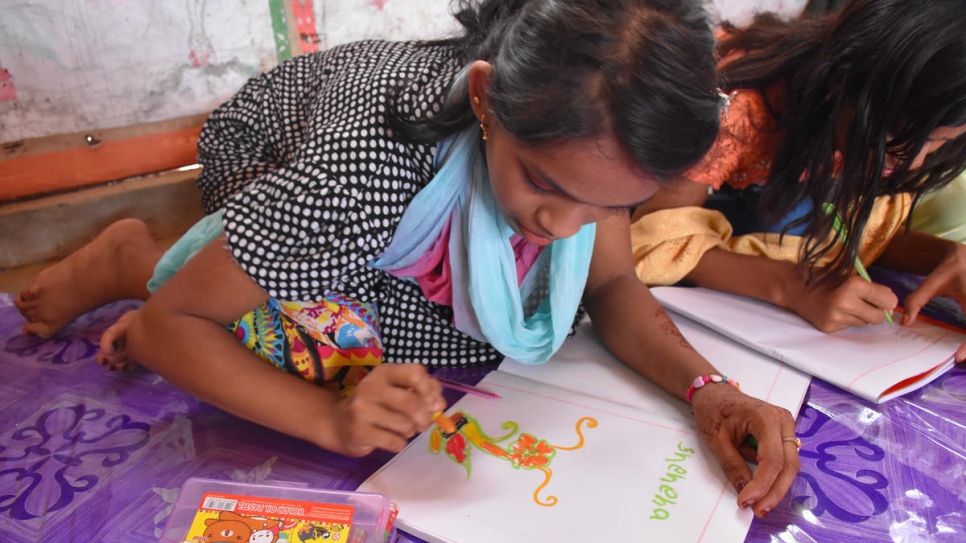 Shehana, 16, loves learning at the Diamond Adolescent Club, set up by UNHCR partner CODEC. Education runs in the family: her brother, Mohammed Sharif, studies with the boys in the afternoon and her sister, Janatara, teaches at a home-based learning centre.