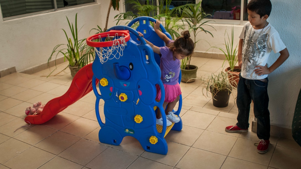 Brenda's grandchildren play at a daycare center in Mexico, where women and children come for meals, psychological help, literacy classes, and to bathe.