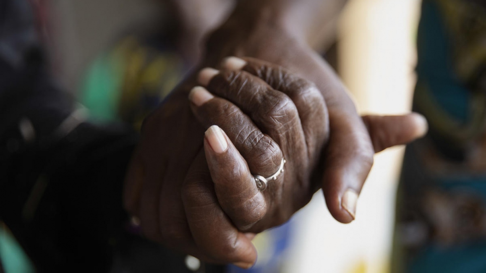 Two members of the 'Standing Women' association hold hands during Mother's Day celebrations in Bangui, Central African Republic.
