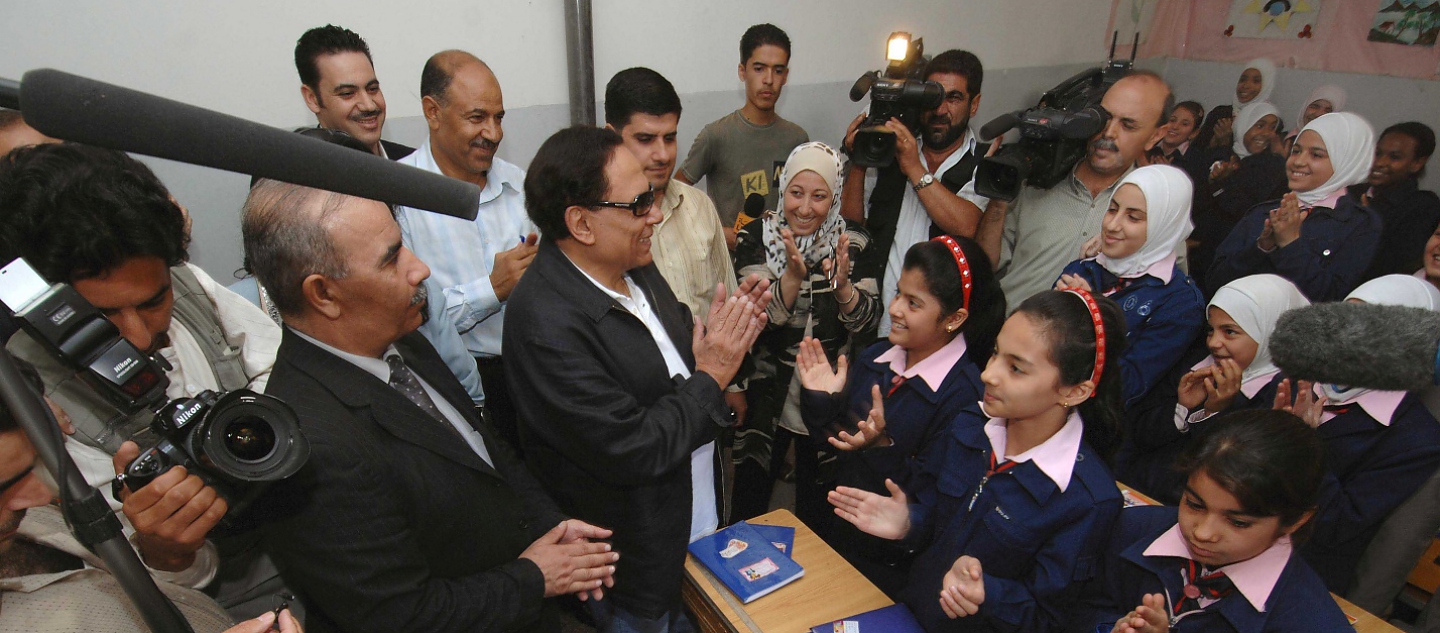 Syria / Adel Imam, UNHCR Goodwill Ambassador talks with  Iraqi refugee children at a school in Saida Zeinab on his two day visit to Damascus, Syria. / UNHCR / J. Wreford / 12 September 2007