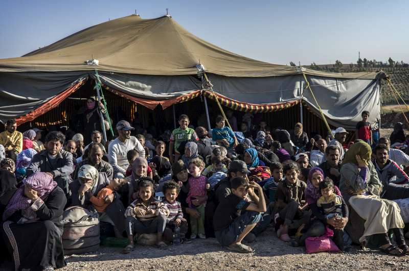 Newly arrived Syrian refugees await transfer to the Za'atri refugee camp from the Jordanian military camp near the border.